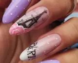 Manicure hybrydowy w stylu paryskim z wieżą Eiffla i różami.