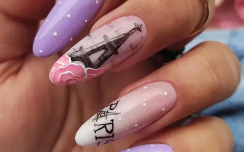 Manicure hybrydowy w stylu paryskim z wieżą Eiffla i różami.