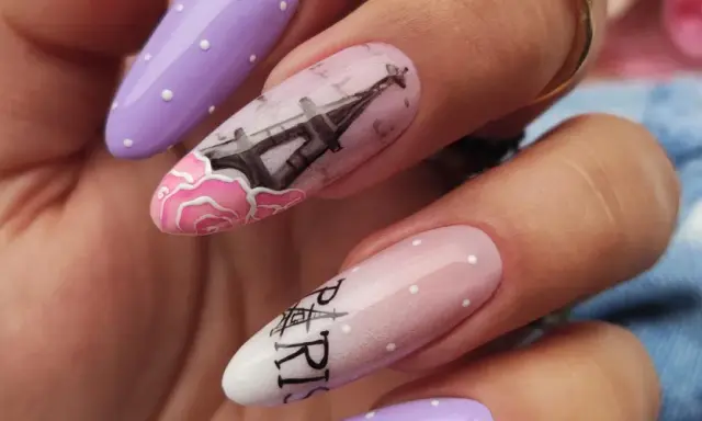 Manicure hybrydowy w stylu paryskim z wieżą Eiffla i różami.